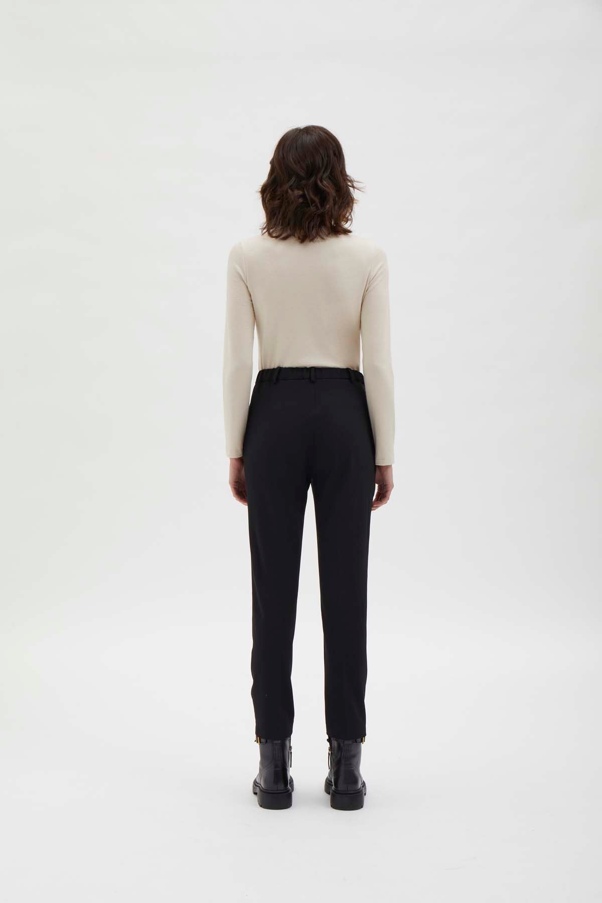 Cigarette pants with detail at waist. Black