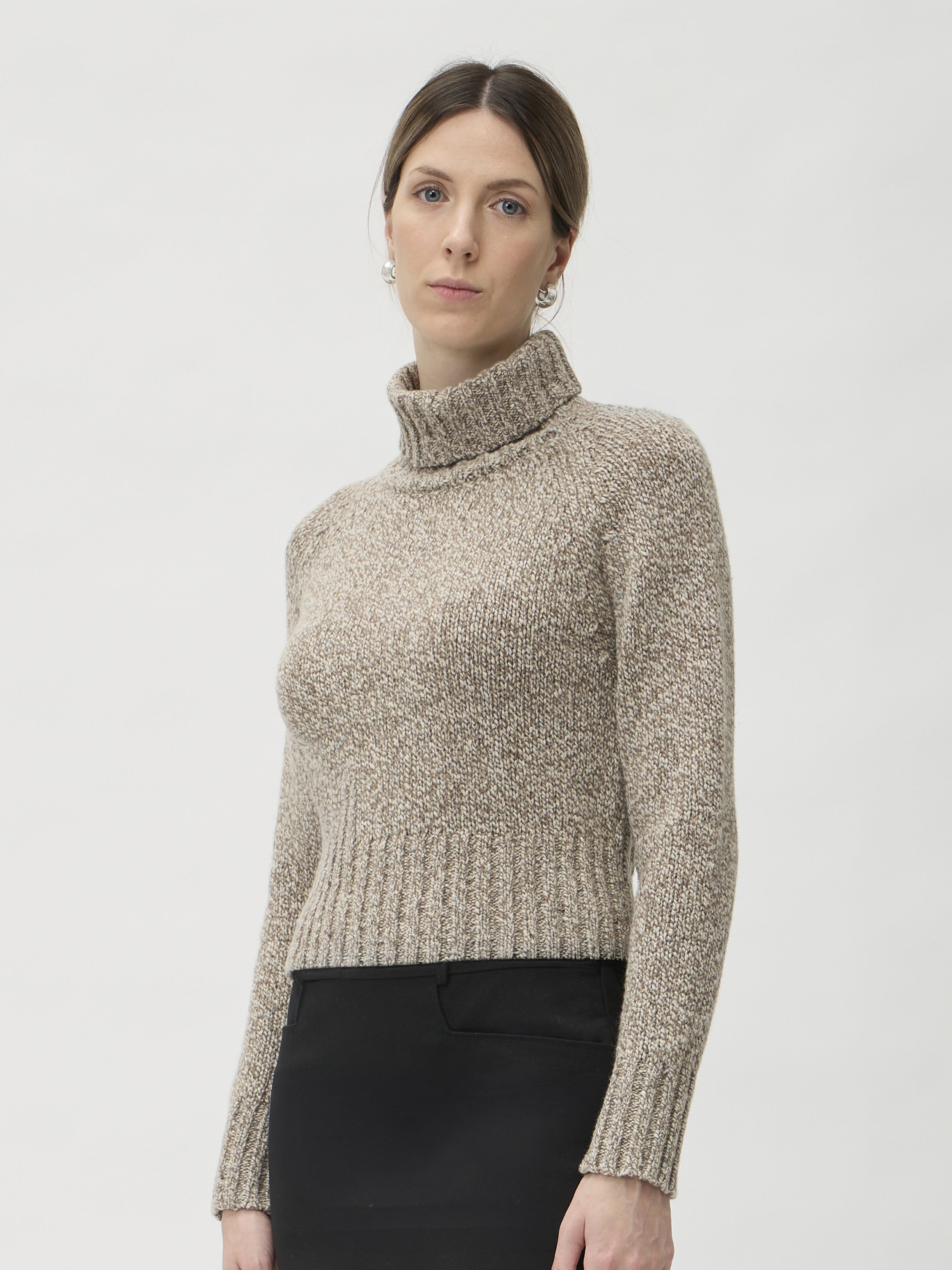ELISE GUG Sweater with High Collar in Dixit 7083 Beige Melange – side view showing silhouette and ribbed cuff