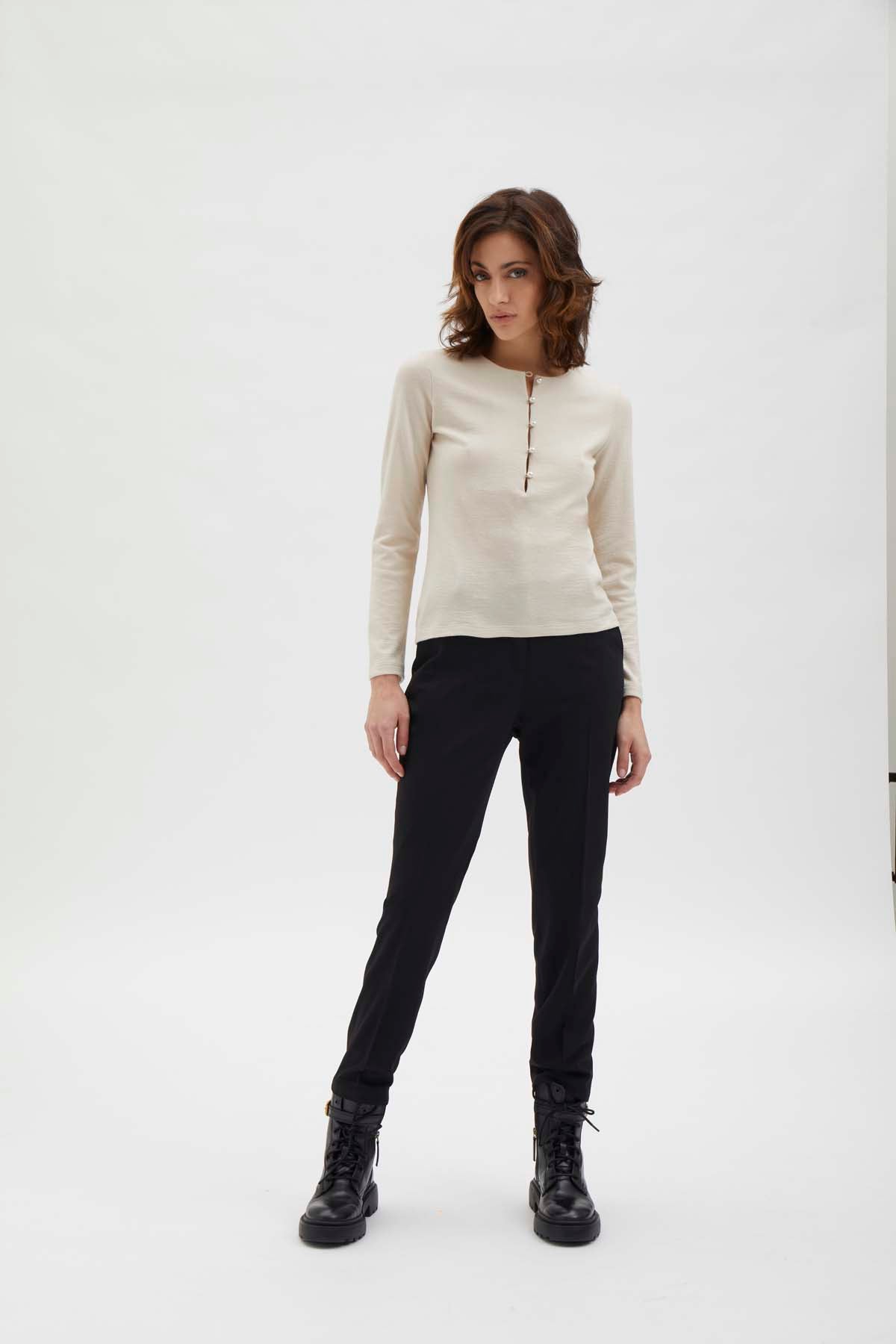 Cigarette pants with detail at waist. Black
