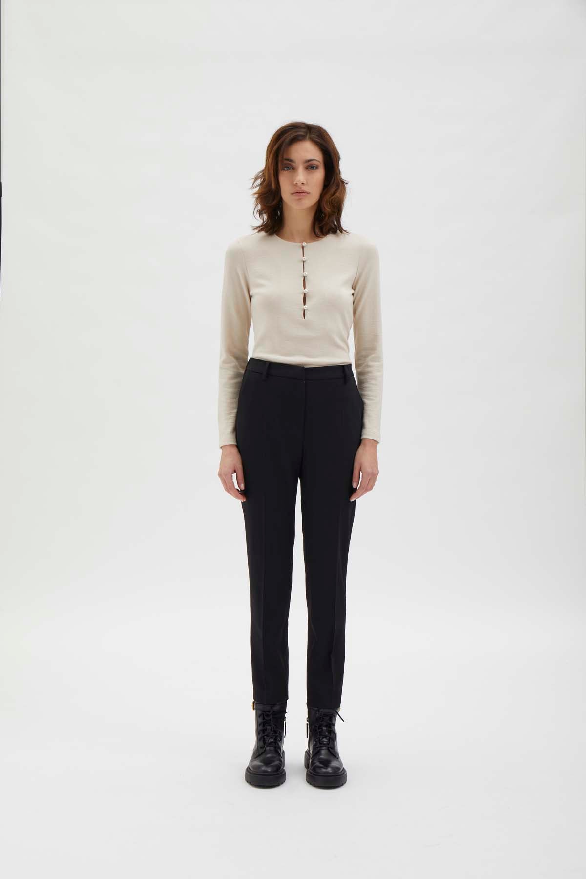 Cigarette pants with detail at waist. Black