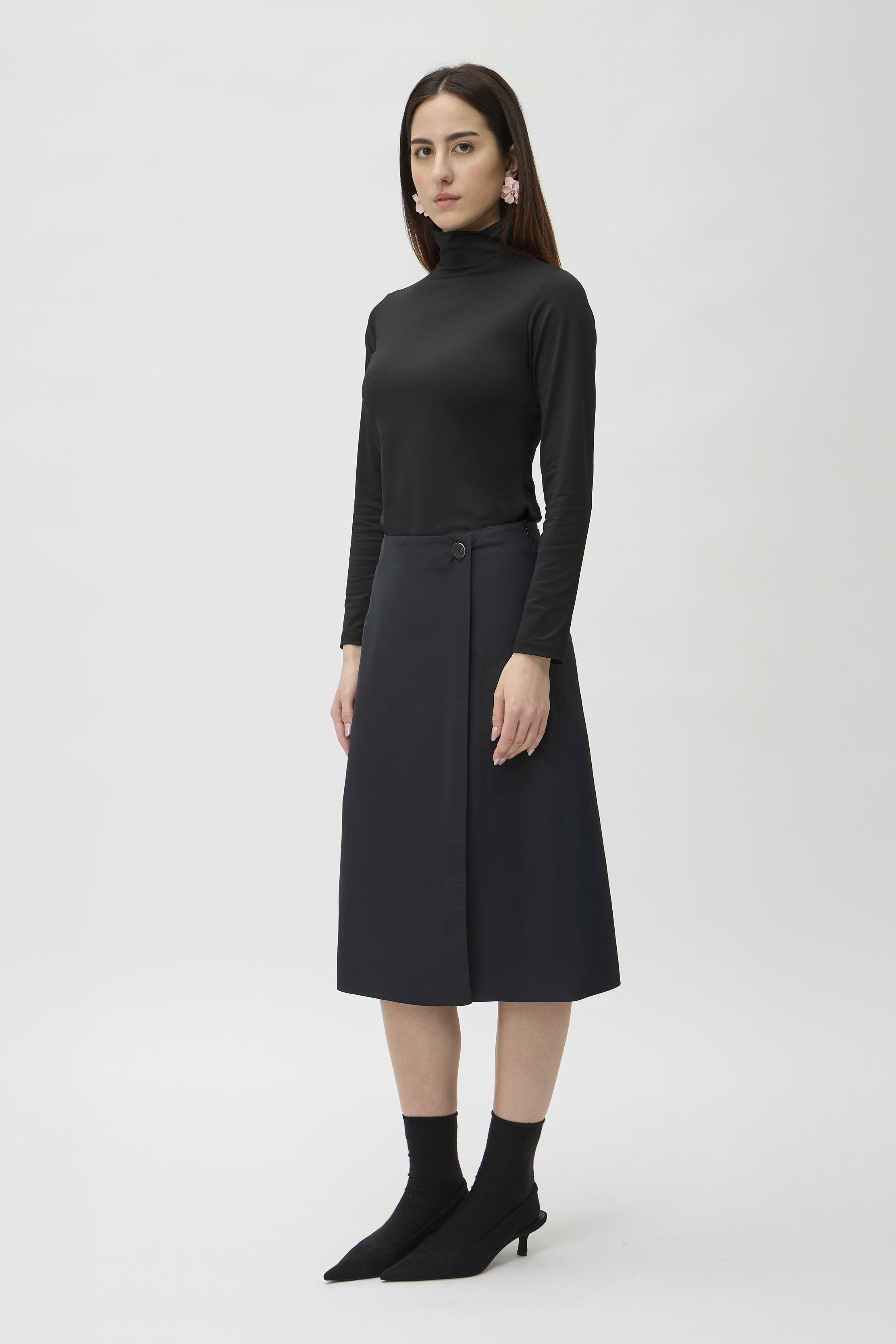 Wrap Skirt in Canguro 3363 Black – model side view styled with black turtleneck – ELISE GUG