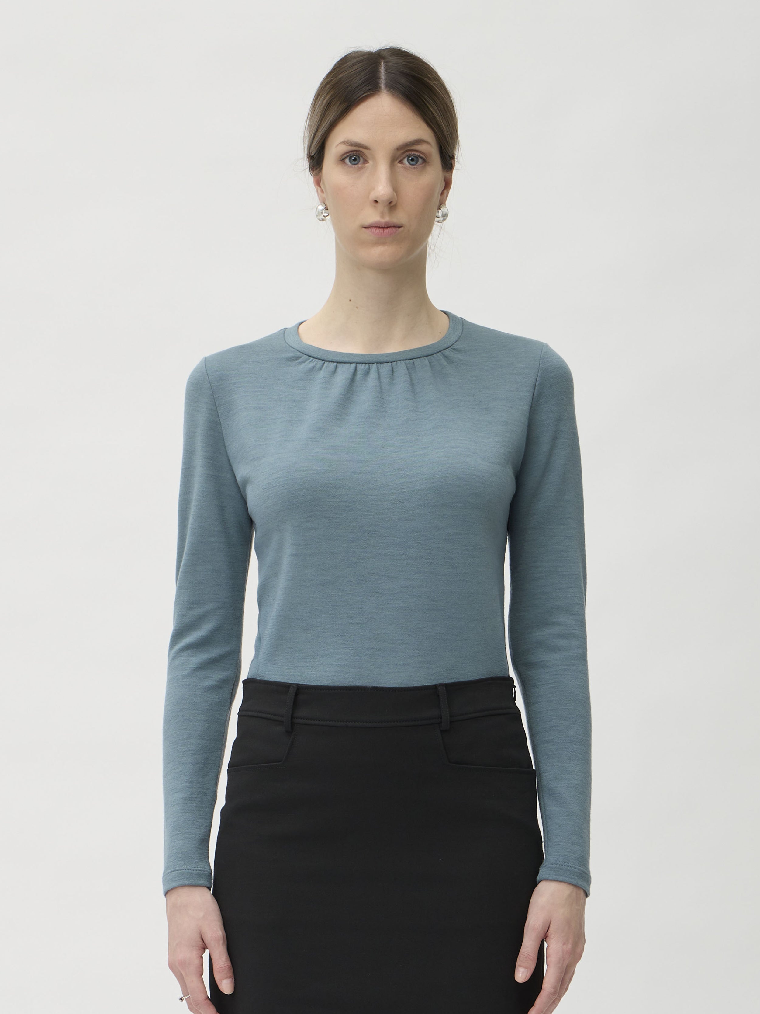 Blouse Wrinkled Neckline in Darfo 1200 Green Blue – model full length front view styled with black midi skirt – ELISE GUG