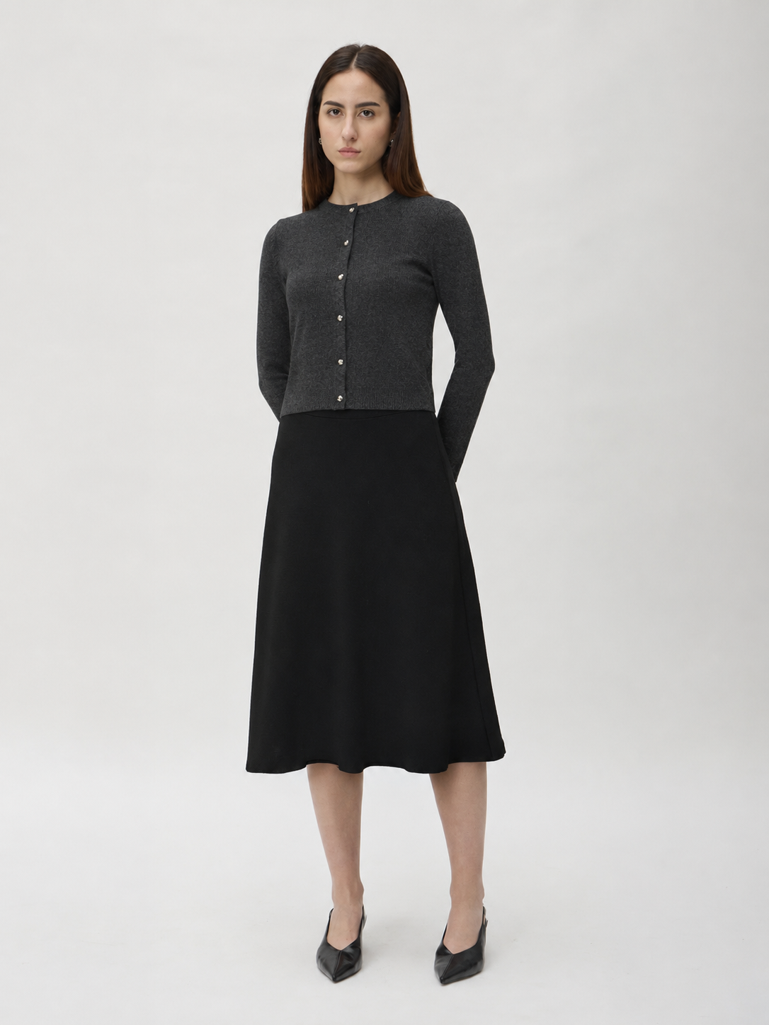 Flared Skirt in Darfo 3365 Black – worn by model, full length front view
