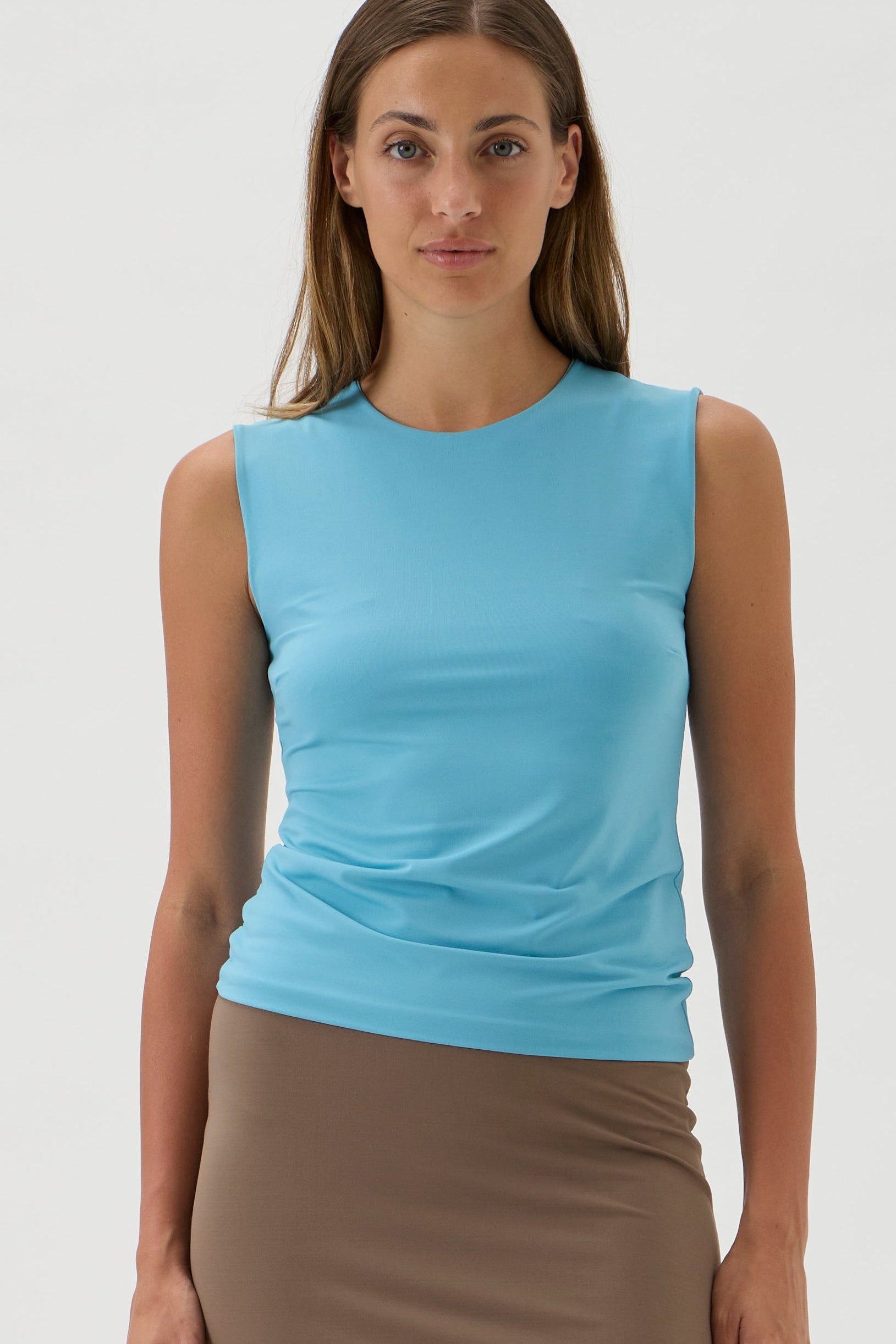 Tailored sleeveless Nilo top styled with relaxed elegance, Pool coloured